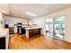 Spacious kitchen features stainless steel appliances, a breakfast bar, and an adjacent dining area, blending style and functionality at 11 Gordon Dr, Castle Rock, CO 80104