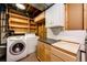A functional laundry room with washer, dryer, storage cabinets, and ample countertop space at 11 Gordon Dr, Castle Rock, CO 80104