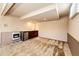 Spacious room featuring a convenient kitchenette and a modern wall heater at 11 Gordon Dr, Castle Rock, CO 80104