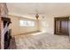 Bright and airy living room featuring a classic fireplace and a large window with natural light at 11 Gordon Dr, Castle Rock, CO 80104