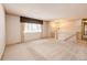 Large living room with neutral carpet, chandelier, and staircase at 11 Gordon Dr, Castle Rock, CO 80104