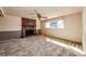 A spacious living room features a brick fireplace and a large window providing ample natural light at 11 Gordon Dr, Castle Rock, CO 80104