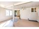 This is a bright enclosed patio with a ceiling fan, providing a comfortable space for relaxation and enjoying the outdoors at 11 Gordon Dr, Castle Rock, CO 80104