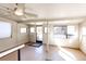 Bright sunroom with multiple windows, ceiling fan, and access to the backyard at 11 Gordon Dr, Castle Rock, CO 80104
