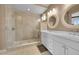Bathroom with a glass-enclosed shower and double sinks at 3574 Corsica Way, Castle Rock, CO 80109