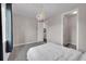Bright bedroom features an antler chandelier, plush carpet, and a walk-in closet at 3574 Corsica Way, Castle Rock, CO 80109