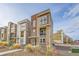 Modern three-story home with stone accents and a small balcony in a well-planned, colorful community at 3574 Corsica Way, Castle Rock, CO 80109
