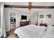 The main bedroom features hardwood floors, modern light fixtures, and a walk-in closet at 3574 Corsica Way, Castle Rock, CO 80109