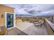 Rooftop patio with lounge chairs, dining table, and neighborhood views at 3574 Corsica Way, Castle Rock, CO 80109