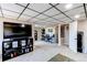 Basement featuring entertainment center, adjacent rec area, and neutral carpeting for a comfortable space at 4010 S Rifle Way, Aurora, CO 80013