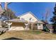 Side view of a two-story home with a well-maintained lawn at 4010 S Rifle Way, Aurora, CO 80013