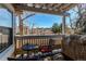 Cozy covered patio with outdoor seating, providing a relaxing view of the neighborhood at 4010 S Rifle Way, Aurora, CO 80013