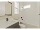 Bright bathroom featuring a tub, vanity with sink, toilet, and modern fixtures at 39417 Stockton Cir, Elizabeth, CO 80107