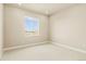 Bright bedroom featuring plush carpeting, and large window with neighborhood views, ensuring a cozy and inviting retreat at 39417 Stockton Cir, Elizabeth, CO 80107