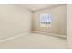 Cozy bedroom filled with natural light featuring plush carpeting and a large window, creating a warm and inviting atmosphere at 39417 Stockton Cir, Elizabeth, CO 80107