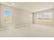 Large bedroom with carpet and three bright windows offering neighborhood views at 39417 Stockton Cir, Elizabeth, CO 80107