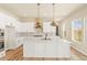 Bright modern kitchen with an island and stainless steel appliances at 39417 Stockton Cir, Elizabeth, CO 80107