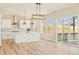 The bright kitchen features a large island, stainless appliances, and access to the outdoor deck at 39417 Stockton Cir, Elizabeth, CO 80107