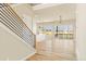Bright open-concept living space with wood floors, large windows, and a modern staircase at 39417 Stockton Cir, Elizabeth, CO 80107