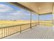 Covered porch with scenic views. A tranquil outdoor space. Perfect spot to sit and relax while enjoying the picturesque landscape at 39417 Stockton Cir, Elizabeth, CO 80107