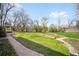 Expansive backyard with manicured lawn and decorative stone features at 6 Martin Ln, Englewood, CO 80113