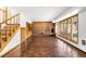 Spacious finished basement featuring a brick fireplace, wood cabinets, and ample room for entertainment at 6 Martin Ln, Englewood, CO 80113