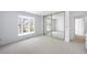 Bright bedroom with a bay window, soft carpeting, a large closet, and neutral decor at 6 Martin Ln, Englewood, CO 80113