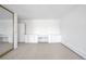 Bright bedroom features built-in dressers, neutral carpet, and natural light at 6 Martin Ln, Englewood, CO 80113