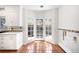 Bright breakfast nook bathed in natural light thanks to the French doors and accent windows at 6 Martin Ln, Englewood, CO 80113