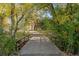 Scenic view of a bridge surrounded by lush greenery and mature trees at 6 Martin Ln, Englewood, CO 80113