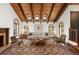 Elegant living room with wooden ceilings, fireplace, and plush seating at 6 Martin Ln, Englewood, CO 80113