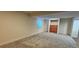 Unfinished basement area with carpeting and a wood-paneled feature area at 12388 Jasmine St, Brighton, CO 80602