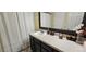 Bathroom features a modern vanity with contemporary decor and soft lighting at 12388 Jasmine St, Brighton, CO 80602