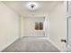 Well-lit bedroom features carpet and a window for ample natural light at 12388 Jasmine St, Brighton, CO 80602