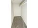 Small walk-in closet with carpet at 12388 Jasmine St, Brighton, CO 80602