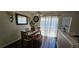 This dining area has modern lighting and sliding glass door to the backyard at 12388 Jasmine St, Brighton, CO 80602