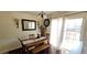 Dining area features modern lighting and sliding glass door to patio at 12388 Jasmine St, Brighton, CO 80602