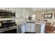 Bright kitchen with stainless steel appliances adjacent to dining area at 12388 Jasmine St, Brighton, CO 80602
