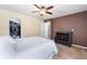 Relaxing main bedroom with plush carpeting, a ceiling fan, and a large closet at 12388 Jasmine St, Brighton, CO 80602