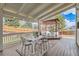 Back deck with dining table and chairs, plus a covered area with outdoor seating at 17979 E Dorado Dr, Centennial, CO 80015
