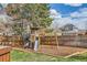 Backyard featuring a play structure with slide and swings, surrounded by a wood fence at 17979 E Dorado Dr, Centennial, CO 80015