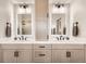 Bright bathroom featuring double sinks, modern fixtures, and a large mirror for a spa-like experience at 17979 E Dorado Dr, Centennial, CO 80015
