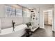 Luxurious bathroom with a freestanding tub, glass-enclosed shower, and modern fixtures at 17979 E Dorado Dr, Centennial, CO 80015