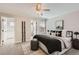 Comfortable bedroom featuring neutral decor, plush carpet, ceiling fan, and an ensuite bath at 17979 E Dorado Dr, Centennial, CO 80015
