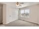Neutral bedroom features a window with blind, soft carpet and a closet with sliding doors at 17979 E Dorado Dr, Centennial, CO 80015