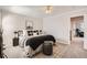 Comfortable bedroom featuring neutral decor, plush carpet, ceiling fan, and an ensuite bath at 17979 E Dorado Dr, Centennial, CO 80015