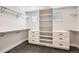 Walk-in closet features custom built-ins, shelving and drawers providing ample storage space at 17979 E Dorado Dr, Centennial, CO 80015
