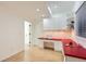 Bright craft room with white cabinets, red counter tops and a large window providing natural light at 17979 E Dorado Dr, Centennial, CO 80015