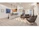 Cozy living room featuring a bar, pendant lighting, and stylish furniture for comfortable living and entertaining at 17979 E Dorado Dr, Centennial, CO 80015