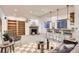 Inviting living area with a fireplace, mini-bar, stylish seating, and ample lighting for comfortable living at 17979 E Dorado Dr, Centennial, CO 80015